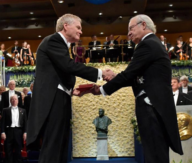 Rockefeller professor Michael Young receiving the Nobel Prize in Medicine in 2017 photo.